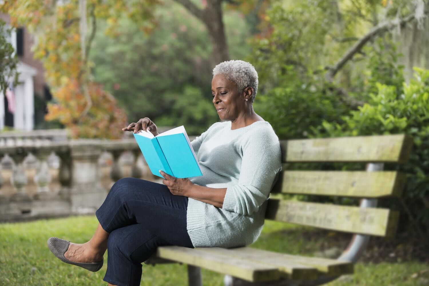 Lady on park bench reading.jpg